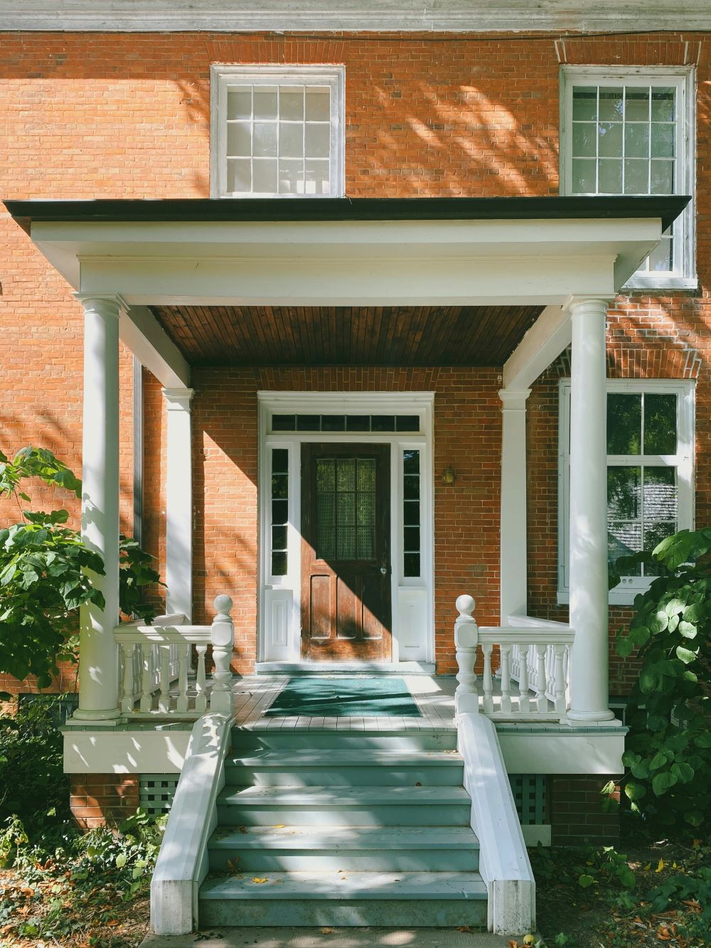 Do you have a damp brick or concrete wall?  Beware of quick fixes